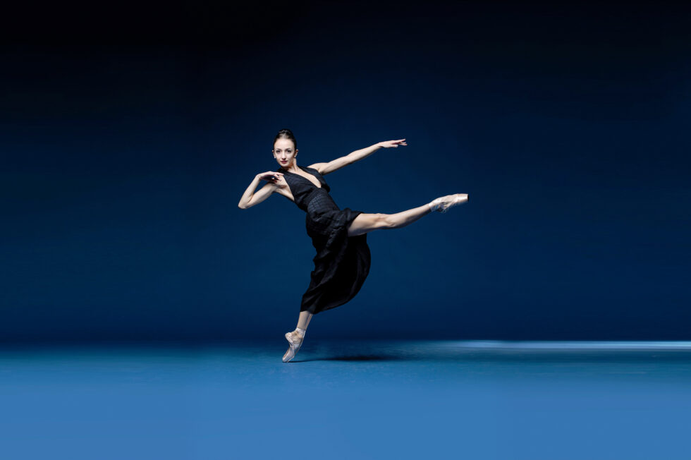 Buse Babadag — black dress, blue studio backdrop